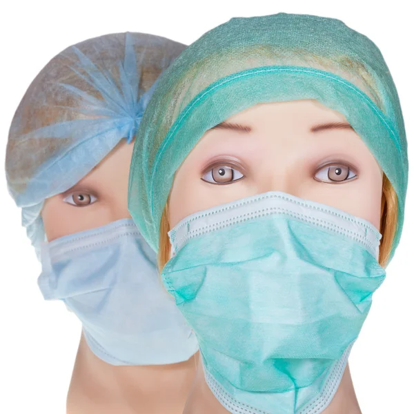 Dummy médico cabeça vestindo tampa cirúrgica têxtil e máscara — Fotografia de Stock