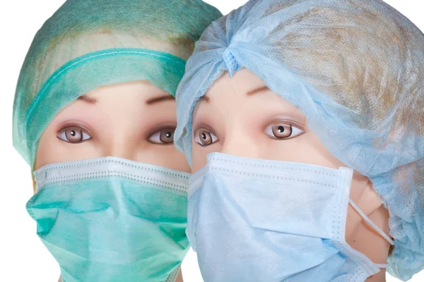 Teste da medico fittizie con cappuccio e maschera chirurgica in tessuto — Foto Stock