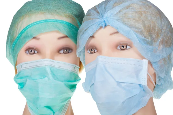 Manichino medico teste indossando tessile berretto chirurgico e maschera — Foto Stock
