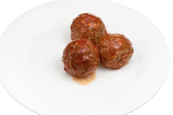 Meatballs under meat sauce — Stock Photo, Image