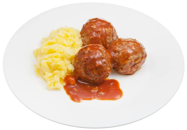Portion of roasted meatballs under meat sauce and mashed potato — Stock Photo, Image