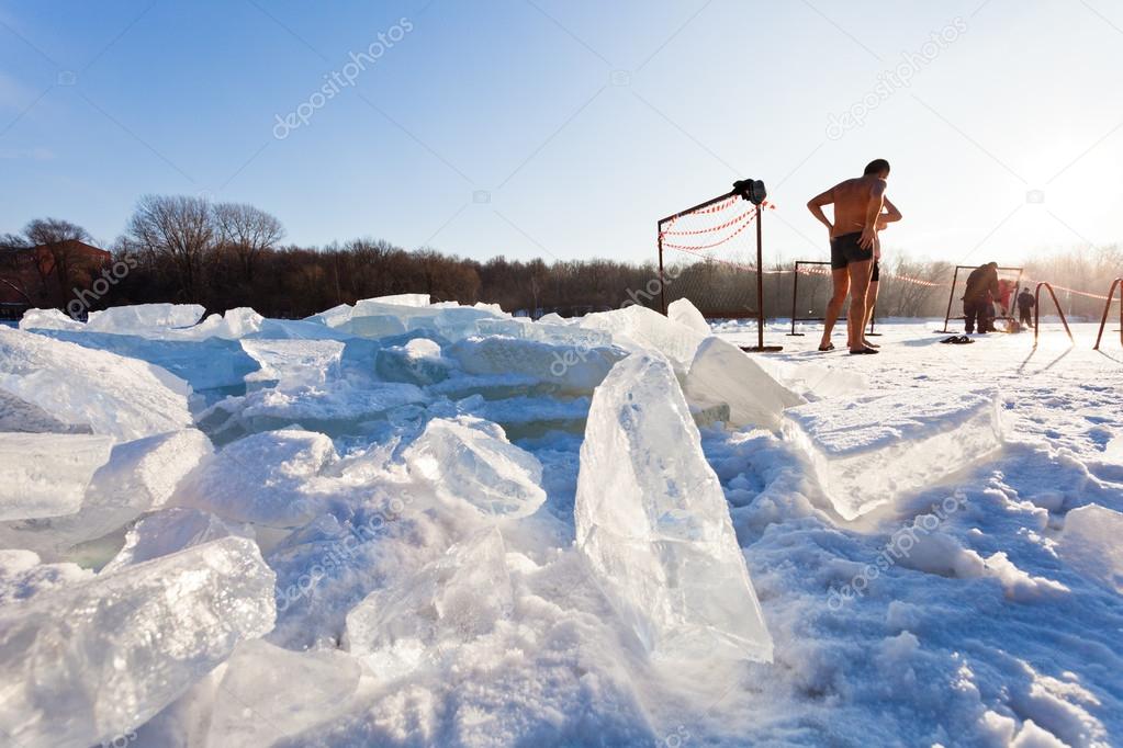 Winter swimmers on frozen river