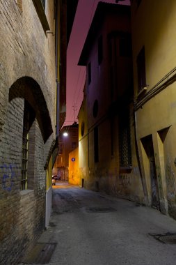 Medieval street in Bologna at night clipart
