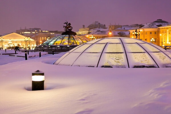 Snow covered glass cupola on Manege square, Moscow