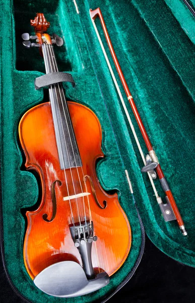 Small violin with bow in green velvet case — Stock Photo, Image