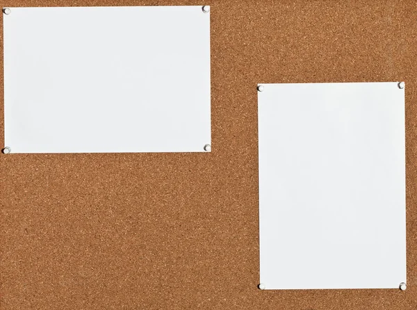 White sheets of paper on cork board — Stock Photo, Image