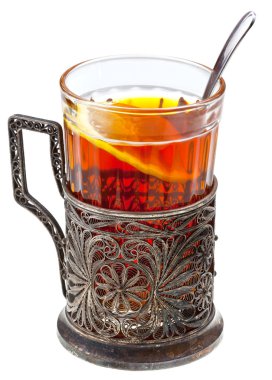 black tea with lemon in retro glass