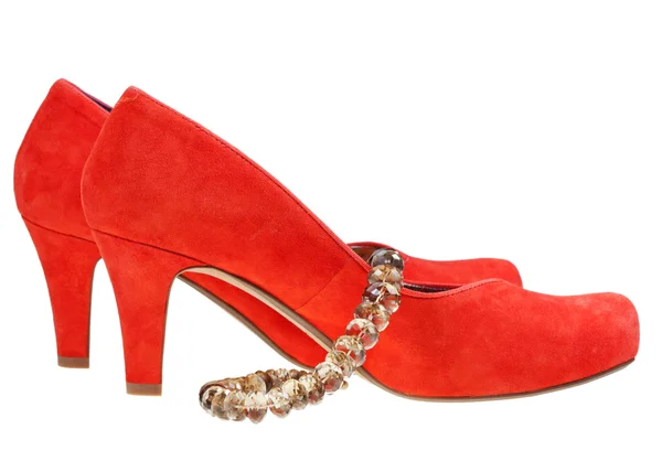 Red high heel pump shoes with necklace — Stock Photo, Image