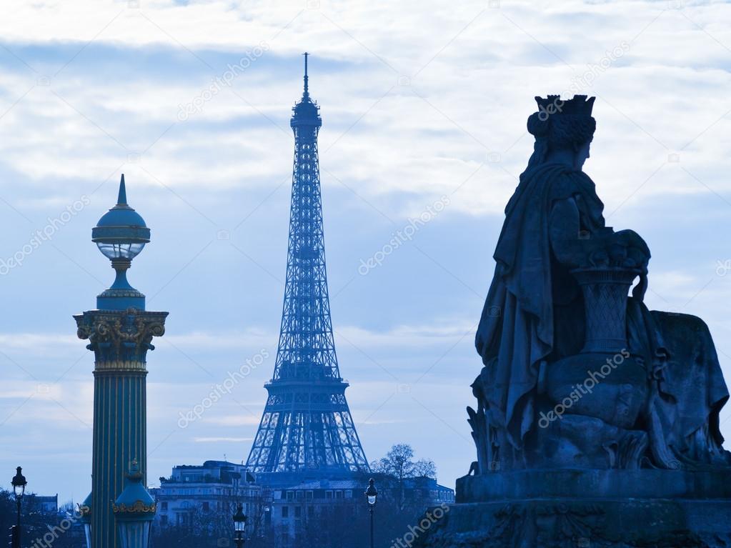 statue, column and Eiffel Tower in Paris