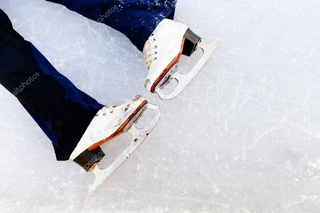 white leather skates on ice