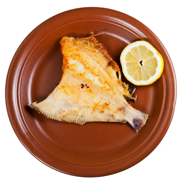 Fried sole fish on brown plate — Stock Photo, Image