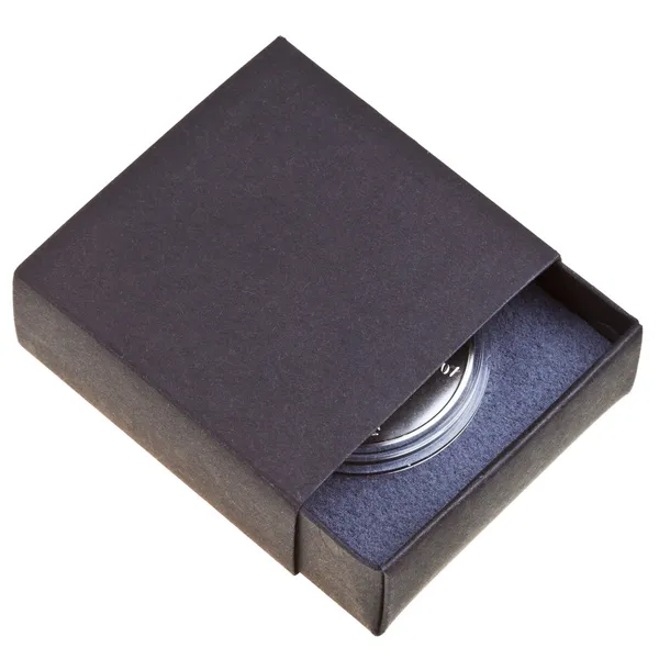 Open black box with silver coin — Stock Photo, Image
