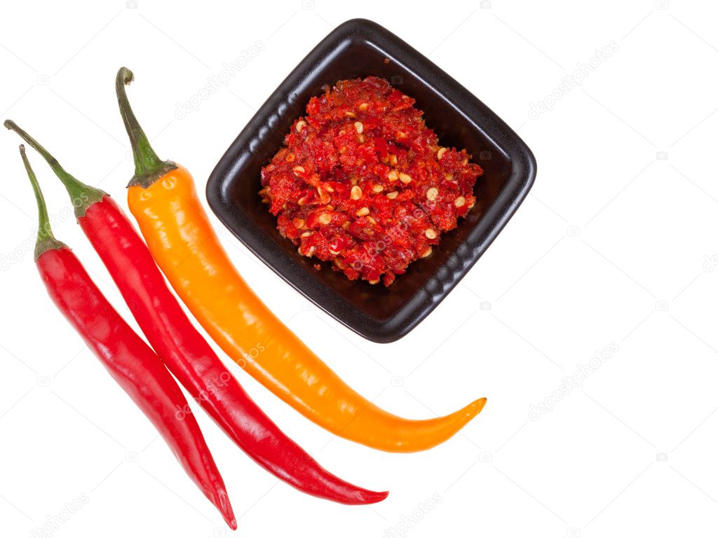 pods of different peppers and spicy sauce