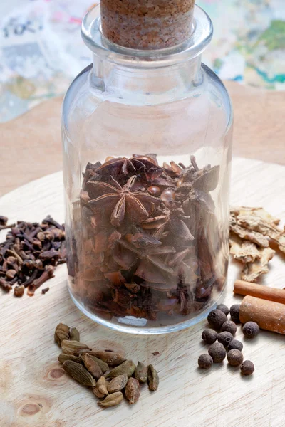 Glass bottle with spices — Stock Photo, Image
