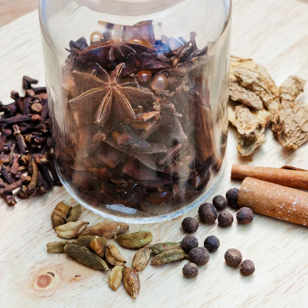 Bottle with various spices for mulled wine — Stock Photo, Image