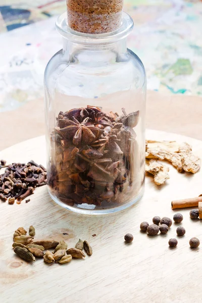 Old glass bottle with spices — Stock Photo, Image