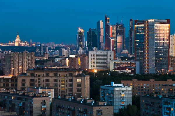 Late summer blue twilight over city — Stock Photo, Image