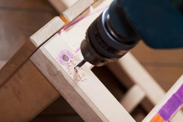 Repair chair with drill — Stock Photo, Image