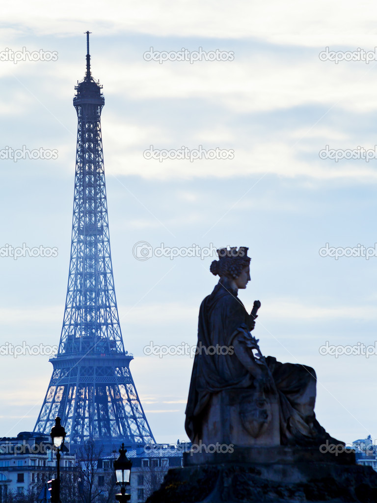 statue and Eiffel Tower in Paris