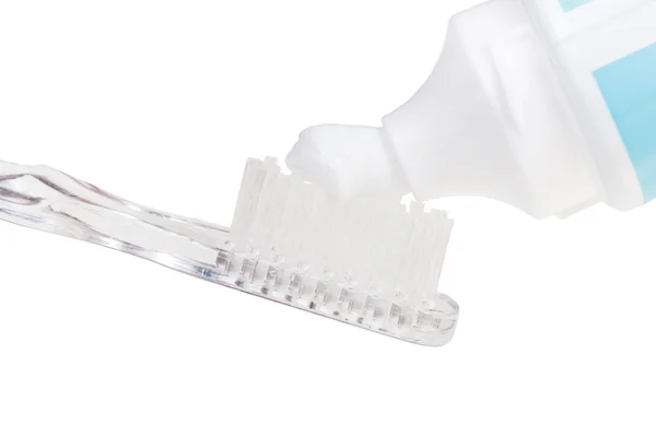 Toothbrush and toothpaste from tube — Stock Photo, Image