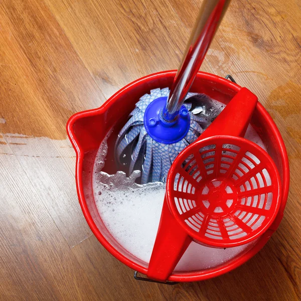 Mop in bucket with water — Stock Photo, Image