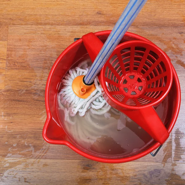 Mop and red bucket — Stock Photo, Image
