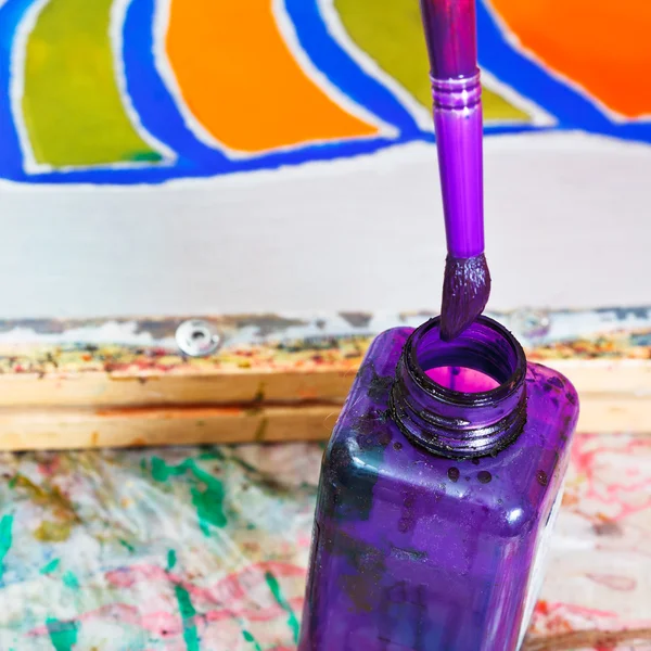 Brush in bottle with dye — Stock Photo, Image
