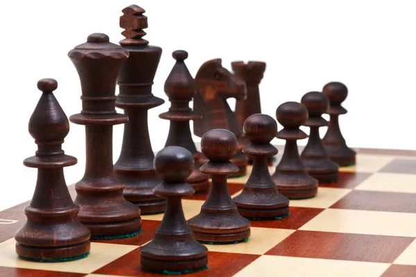 Peças de xadrez preto colocadas no tabuleiro de xadrez — Fotografia de Stock