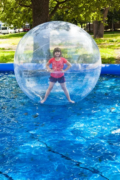 Girl in water ball — Stock Photo, Image