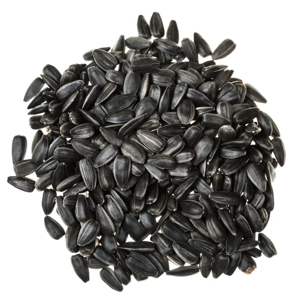 Vista superior da pilha de sementes de girassol torrado preto — Fotografia de Stock