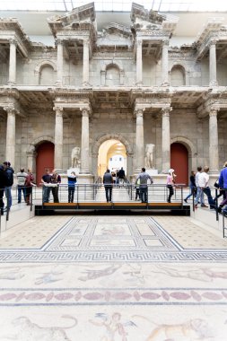 Tourist in Market gate Hall of Pergamon museum clipart