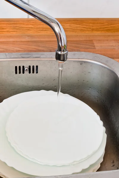 Wash-up in metal washbasin — Stock Photo, Image