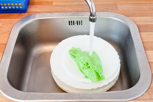 Wash-up by dishcloth — Stock Photo, Image