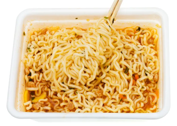 Eating of instant noodles from lunch box — Stock Photo, Image