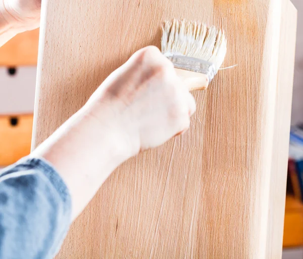 Lacquering by clear varnish of beach wooden board — Stock Photo, Image