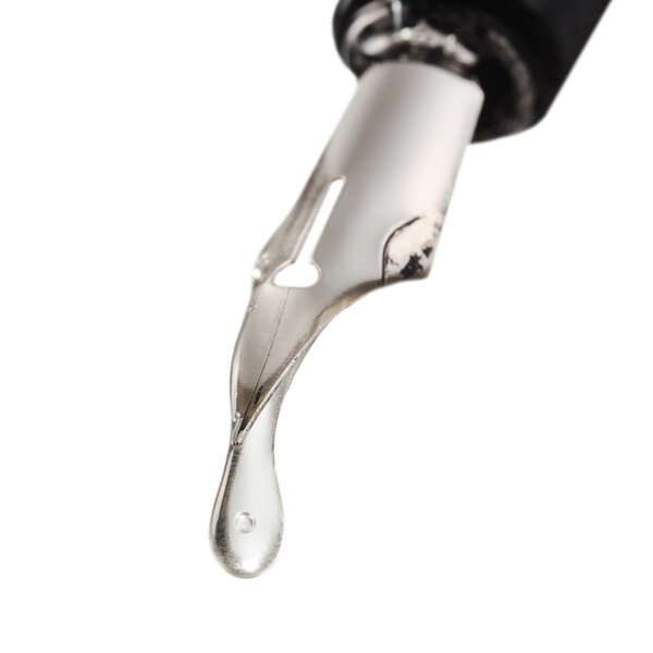 transparent drop dripping from the nib of pen