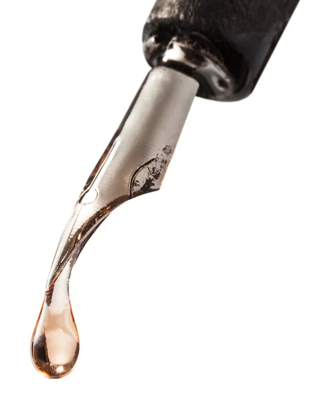 Drop of transparent fluid on nib of pen — Stock Photo, Image
