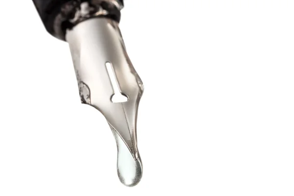 Liquid drop dripping from nib of pen close up — Stock Photo, Image