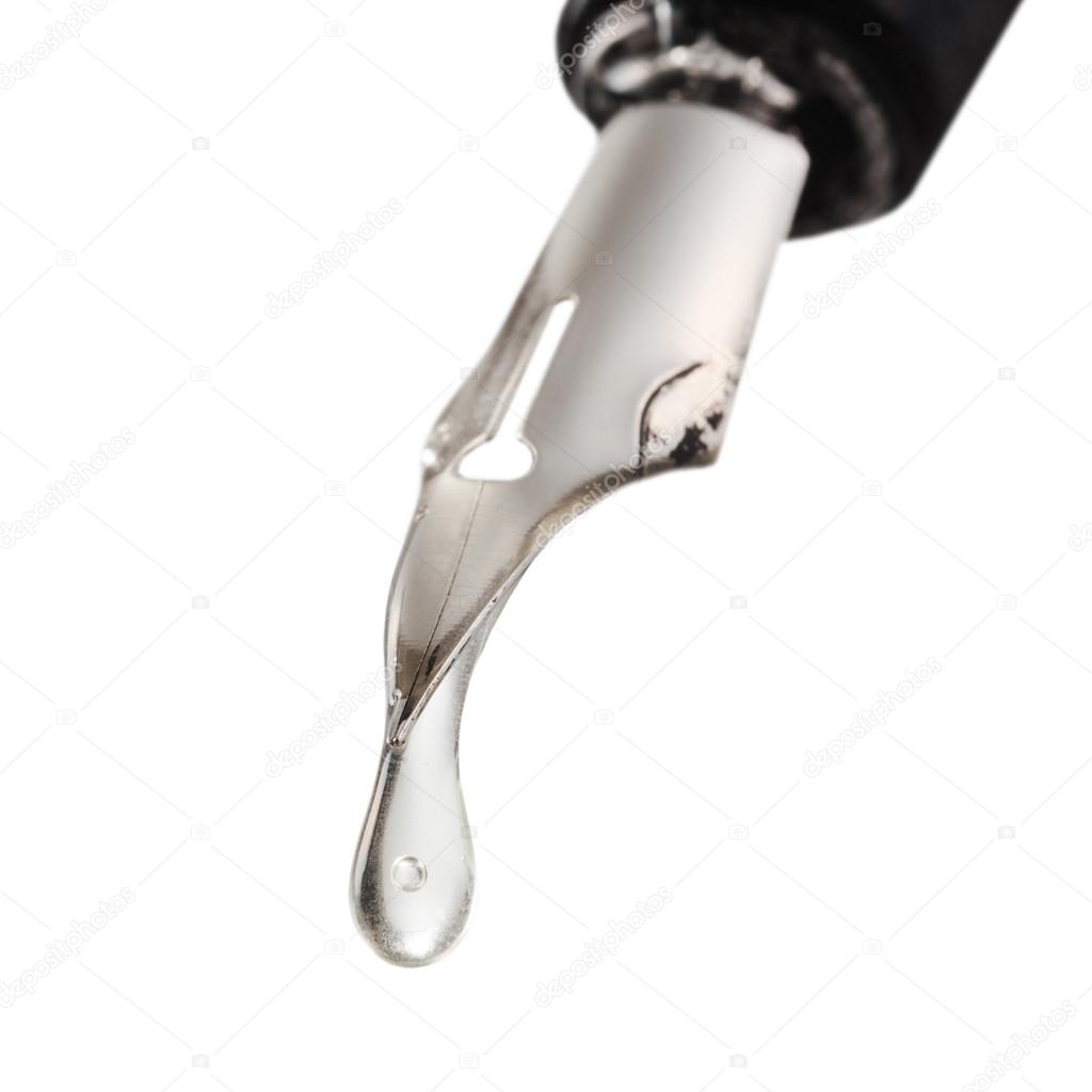 transparent drop dripping from the nib of pen