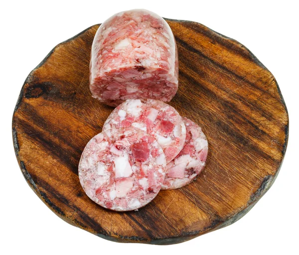 Queso de cabeza de carne en tabla de cortar de madera — Foto de Stock