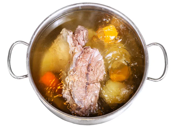 Open steel pan with cooking beef broth — Stock Image Open steel pan with cooking beef broth Royalty Free Stock Images