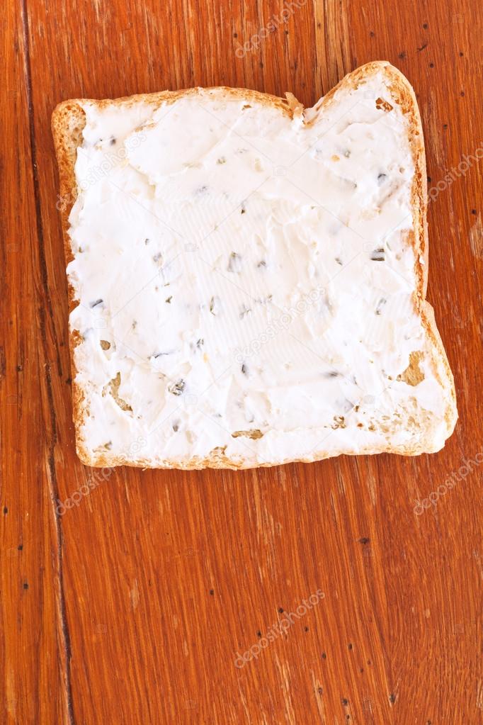 sandwich from toast and soft cheese with herbs