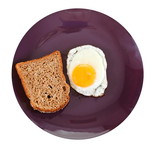 Top view of fried egg and toasted rye bread — Stock Photo, Image