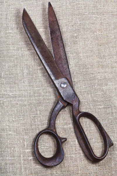 Old tailor scissors on textile — Stock Photo, Image