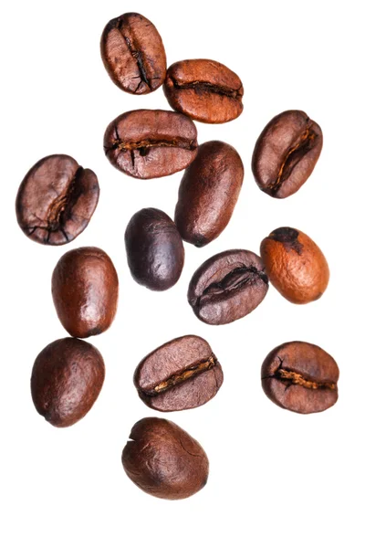 Many falling roasted coffee beans — Stock Photo, Image