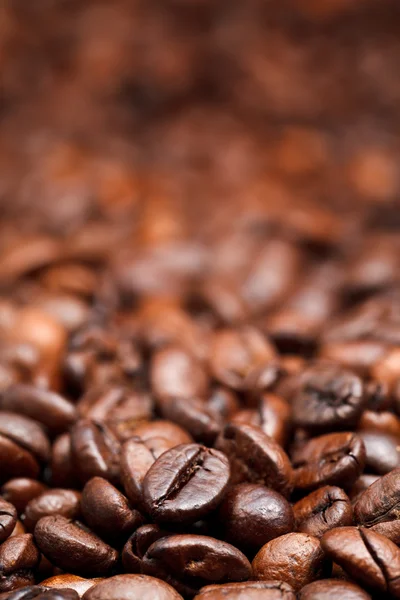 Red roasted coffee beans background — Stock Photo, Image