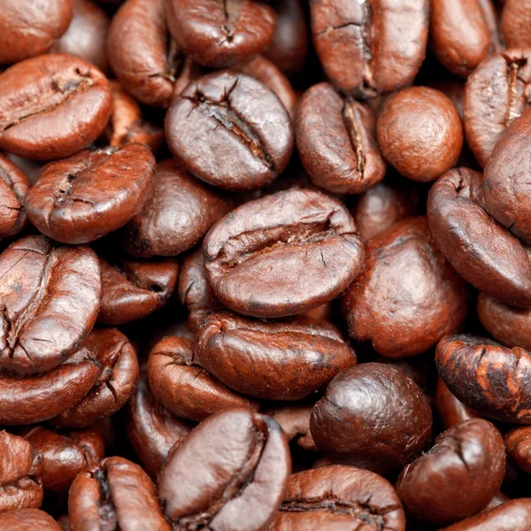 Red roasted coffee beans close up — Stock Photo, Image