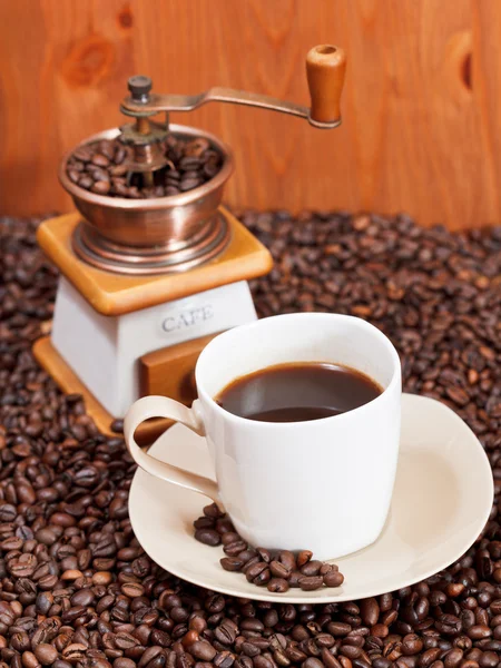 Cup of coffee and roasted beans — Stock Photo, Image