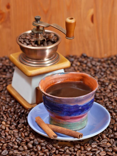 Cup of coffee and roasted beans — Stock Photo, Image