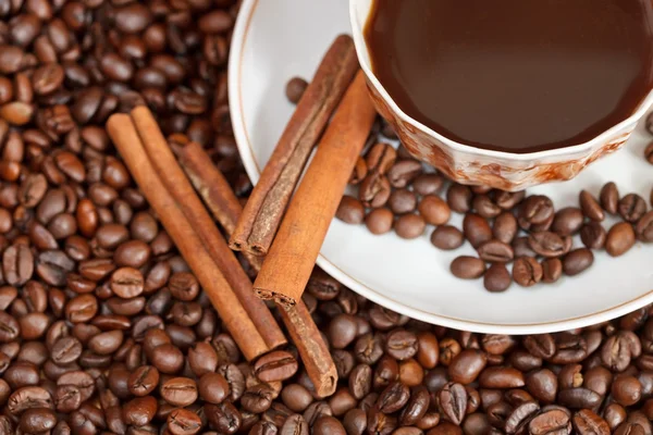 Cup of coffee and roasted beans — Stock Photo, Image